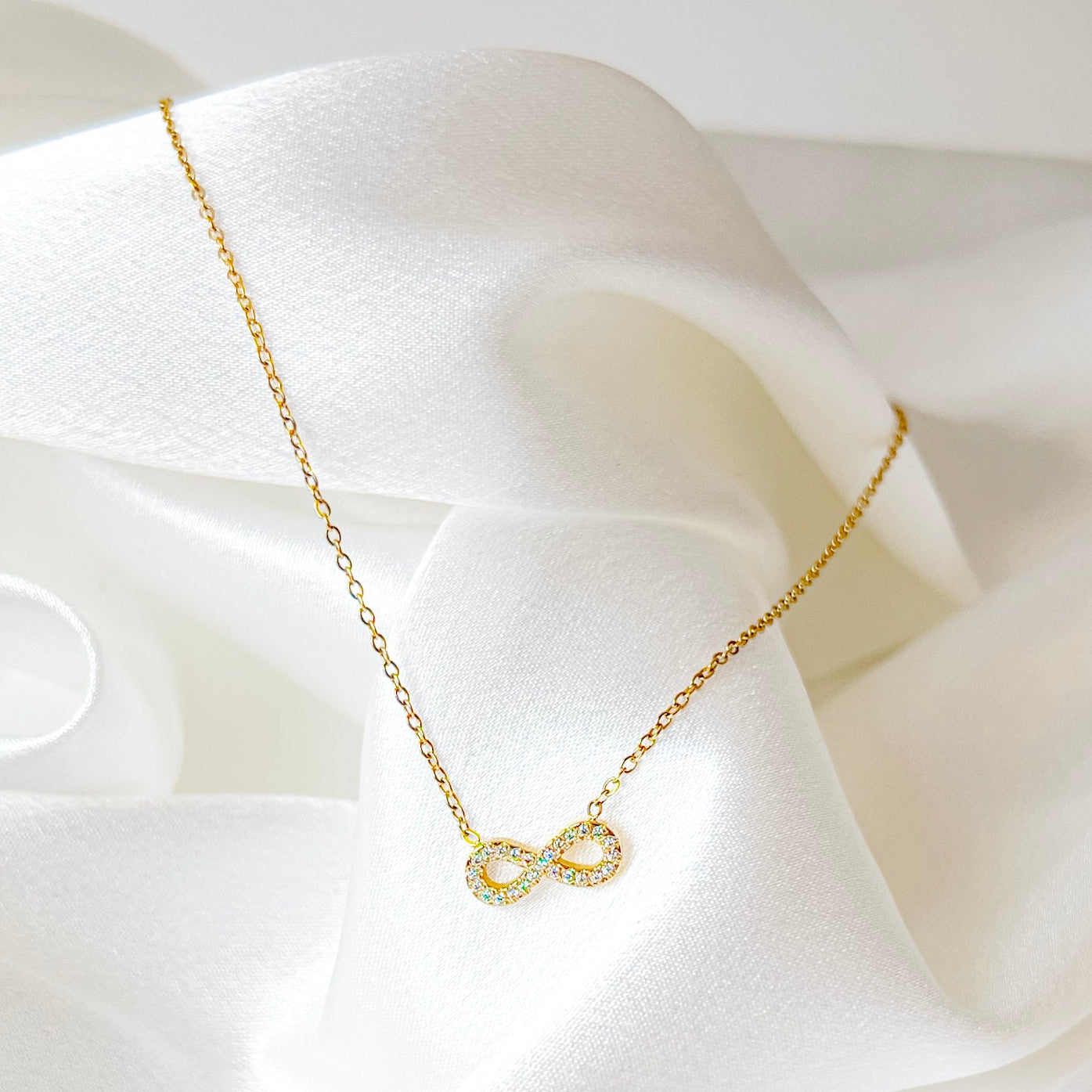 Infinité Necklace | Gold Crystal Infinity Pendant — TJAURI jewelry