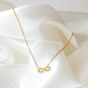 Infinité Necklace | Gold Crystal Infinity Pendant — TJAURI jewelry