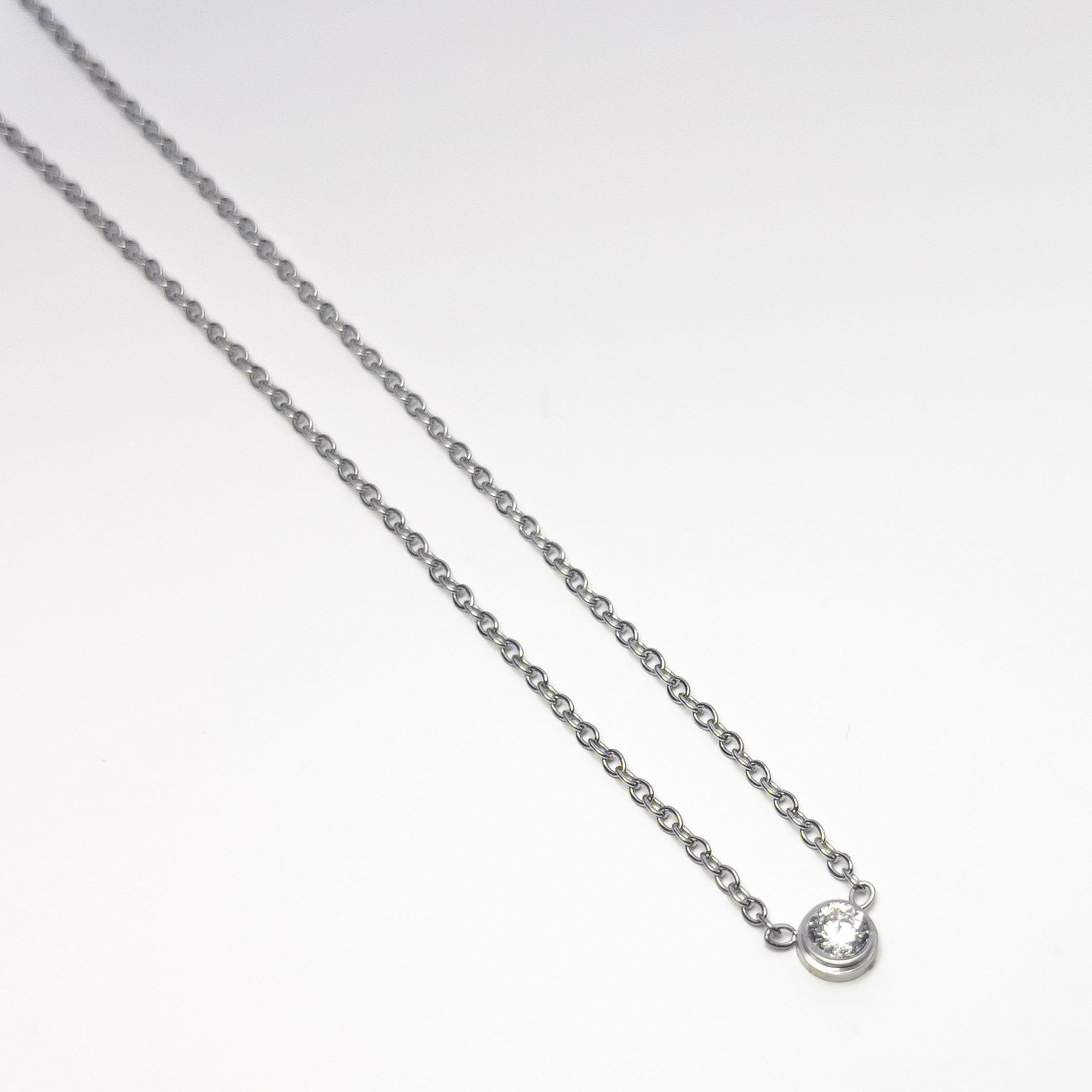 Miréa Necklace | Bezel-Set Crystal Pendant — detail view — TJAURI jewelry